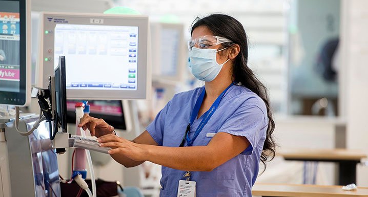 Etobicoke Renal Centre staff member working on dialysis equipment