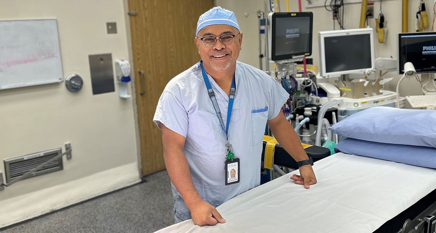 Eligio Acebedo, an Operating Room RN, poses in one of Osler's operating rooms