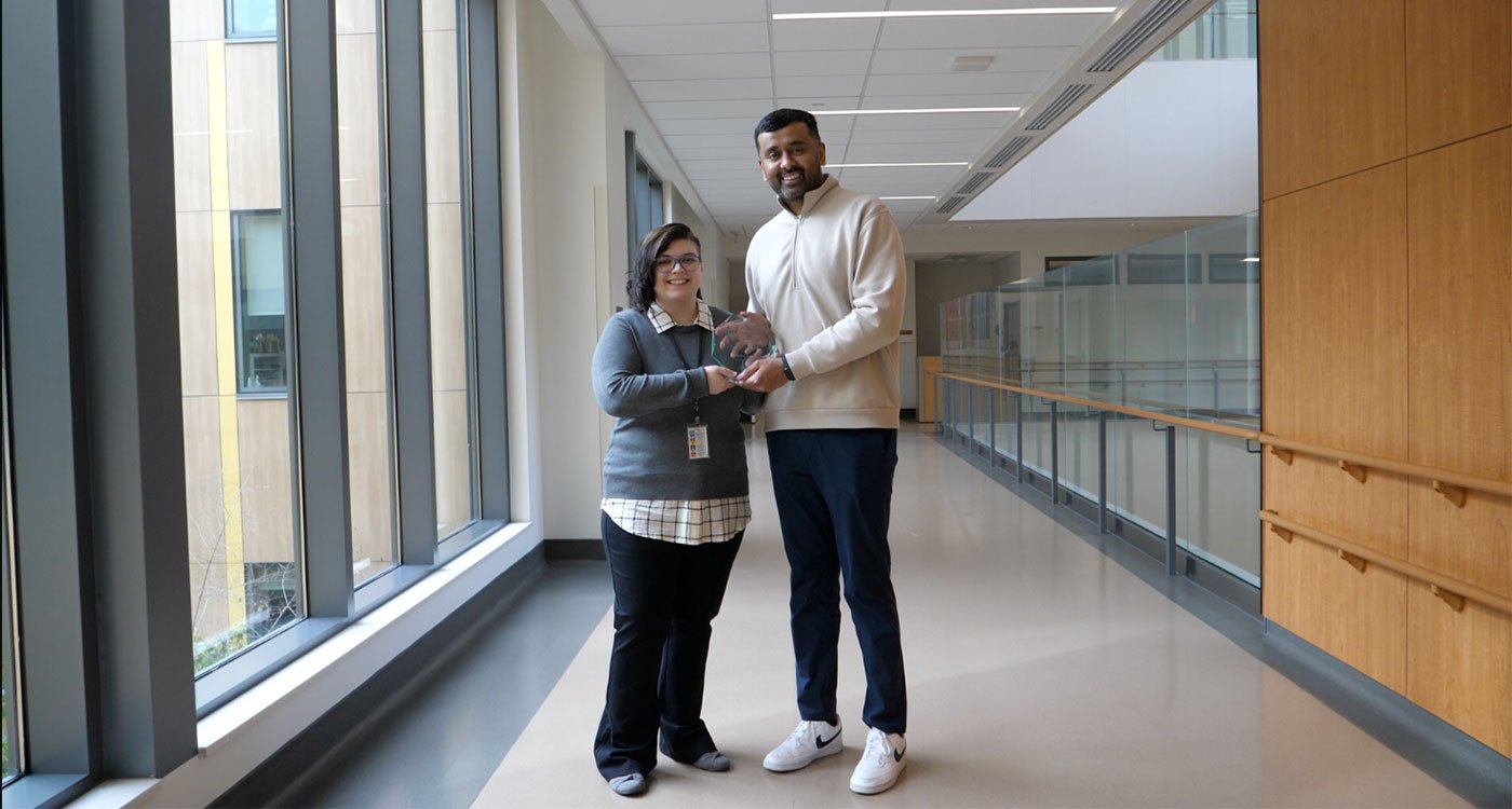 (l-r): Julianne Uzun is presented with her award by Dr. Mateen Akhtar