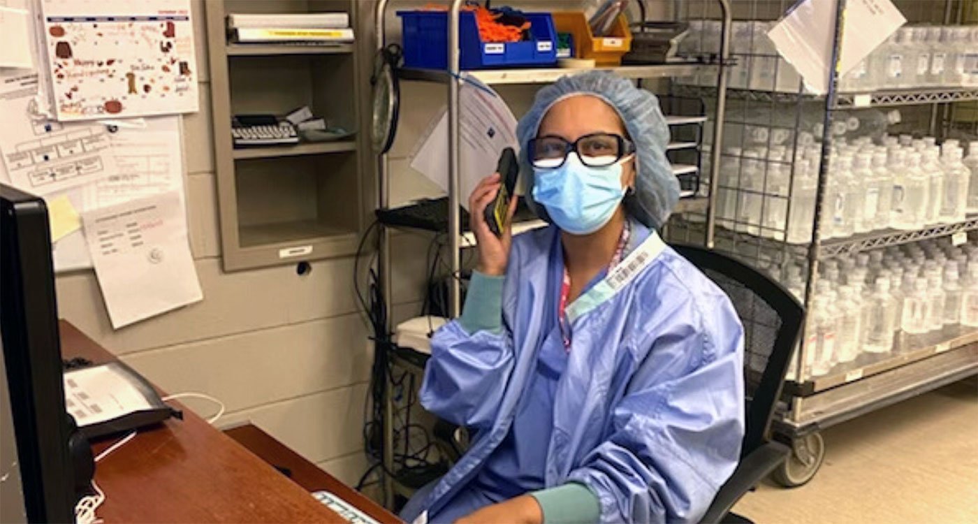 Lalieta, Lead Hand at Etobicoke General, answers a call on her mobile device