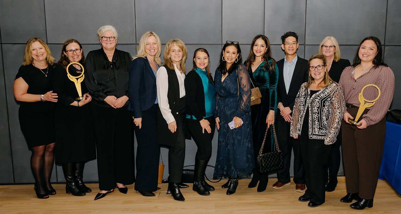 Members of Osler's Healthy Workplace and PoET teams pose for a photo with their awards