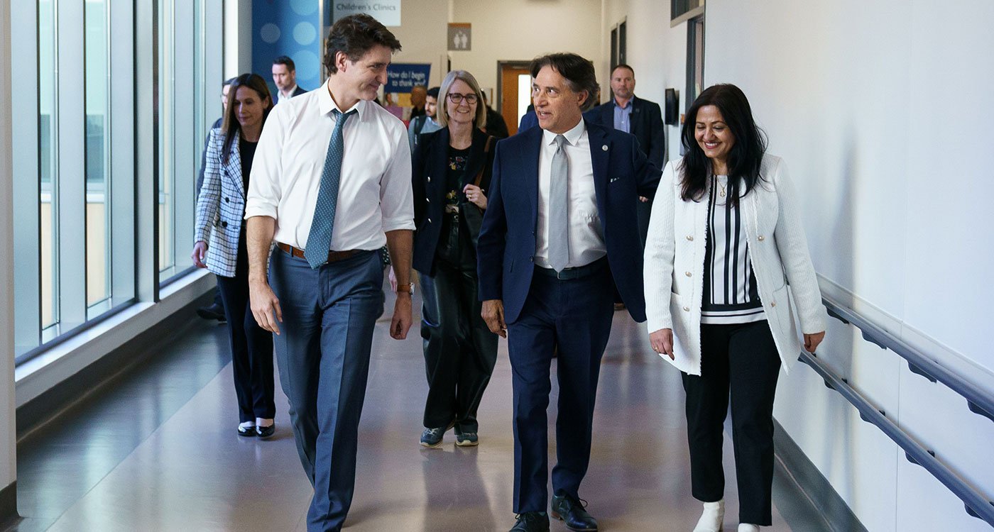 left to right: Prime Minister Justin Trudeau walks the halls of Peel Memorial with Osler's President and CEO Dr. Frank Martino and MP Brampton South Sonia Sidhu