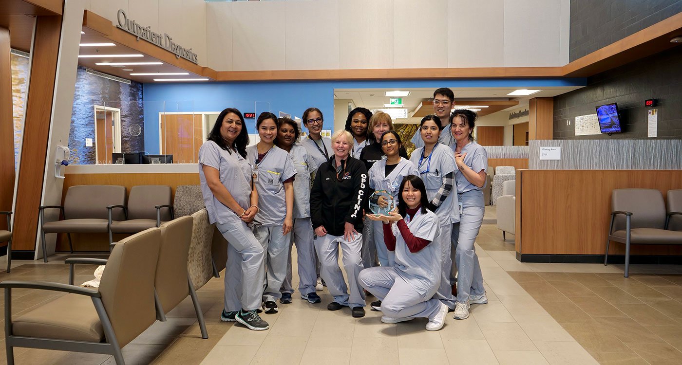 Staff from Osler's Outpatient Department at Etobicoke General Hospital pose with their Values Champion Award