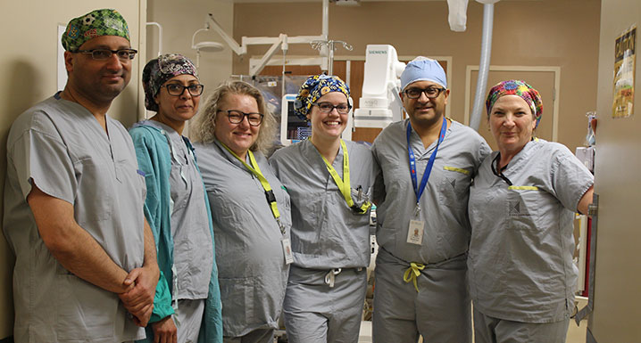 Some members of Brampton’s Civic cardiac team pose outside one of the hospital’s Cath Labs where they perform a highly-advanced, minimally-invasive procedure one day a month for patients experiencing chronic chest pain