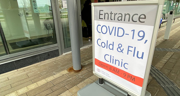 COVID-19, Cold and Flu Clinic signage showing new hours