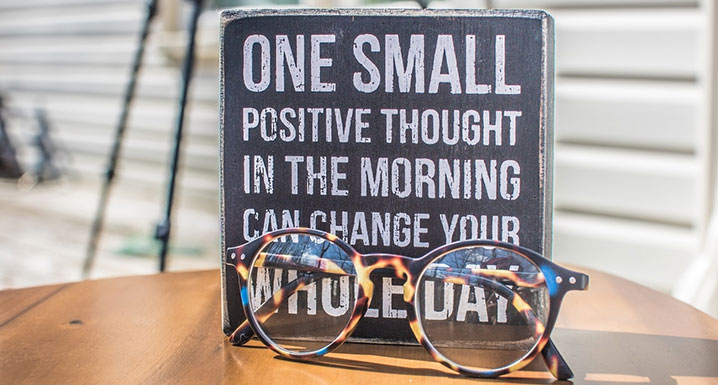A sign that reads one small positive thought in the morning can change your whole day