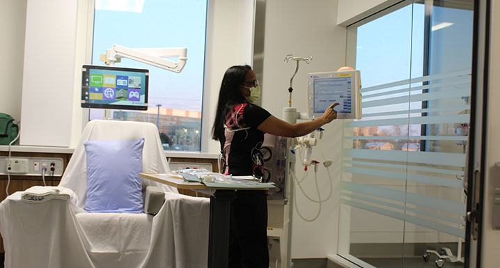 A staff member demonstrates using the dialysis equipment at the new Etobicoke Renal Centre