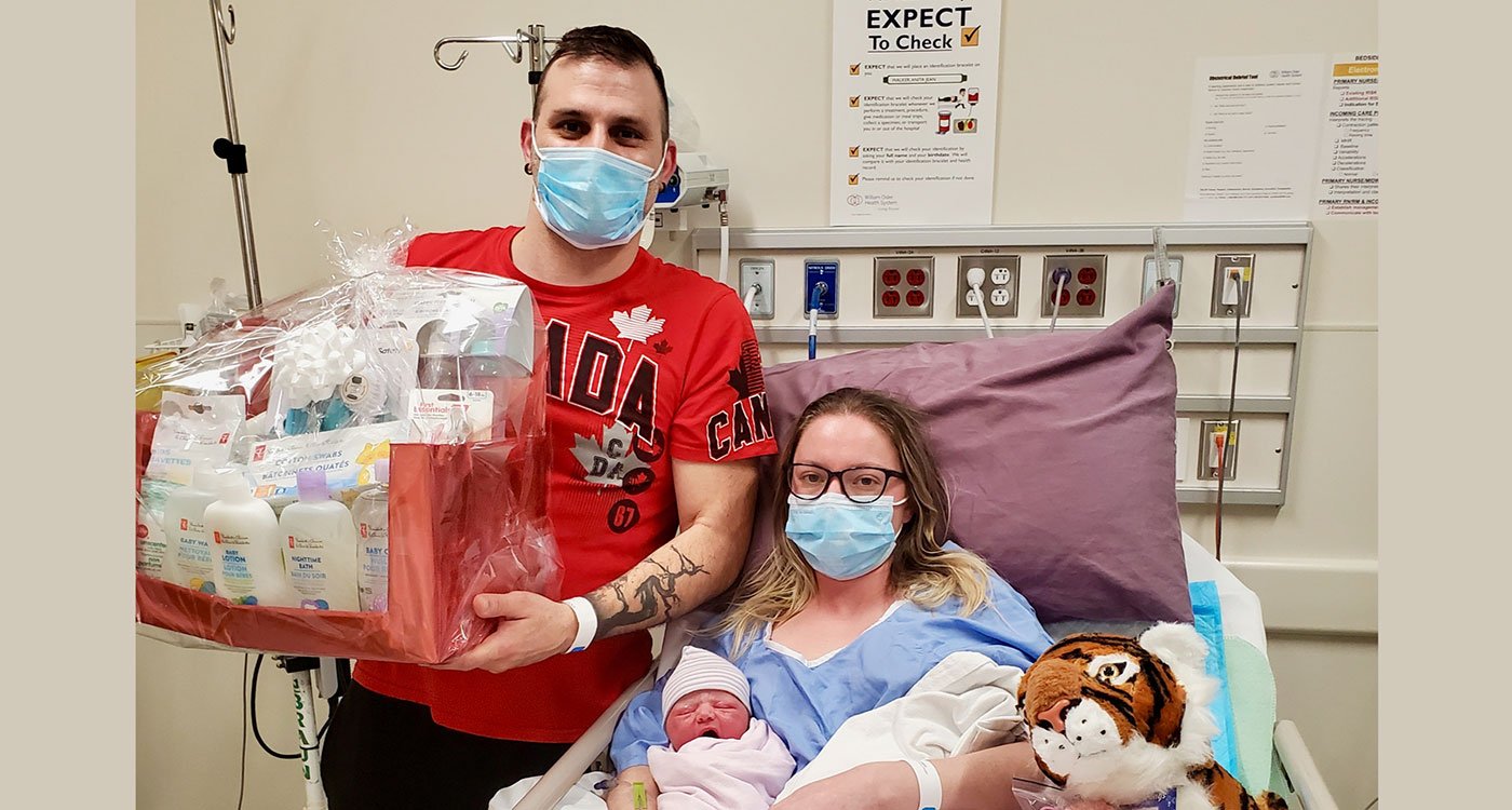 Mother and father in hospital room with their new baby