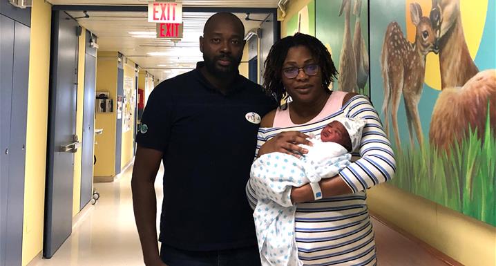 Proud parents, Cheick Diarra (left) and Lala Traore (right) hold their newborn baby boy, Tidiane at Etobicoke General Hospital