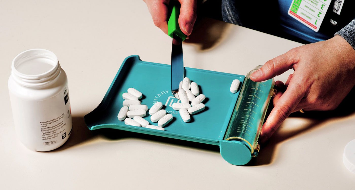 A close up of pills being sorted