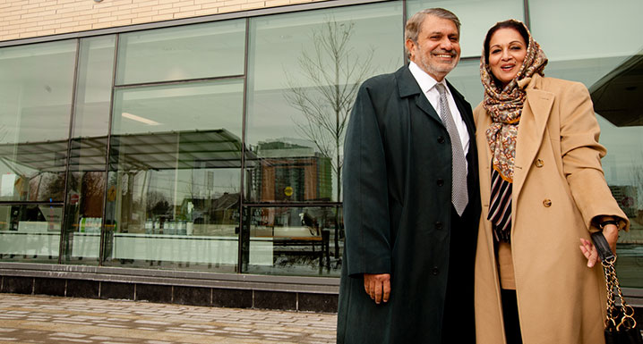 Sajjad Ebrahim and his wife in front of Peel Memorial's Urgent Care Centre