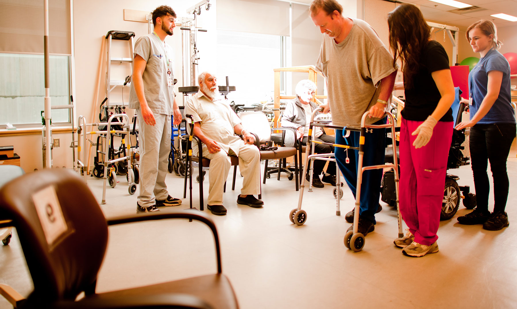 Staff assisting patients in a rehab clinic