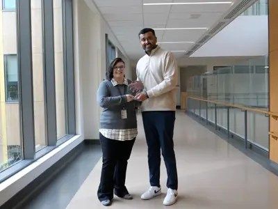 (l-r): Julianne Uzun is presented with her award by Dr. Mateen Akhtar