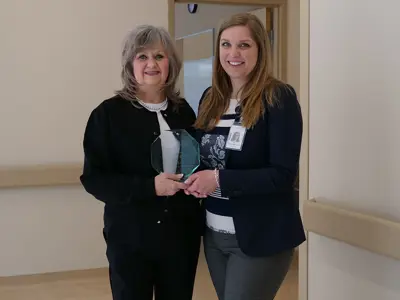 (l-r): Wanda Leah, Clerical Associate, accepts Values Award from Erin Stanners-Moroz, Clinical Lead, Mental Health Outpatient Program